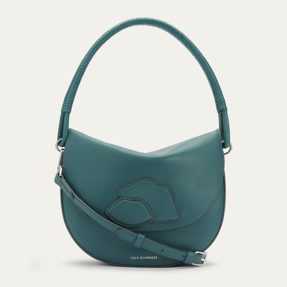 Teal Lulu Guinness crescent bag with a braided top handle and three lips detail.