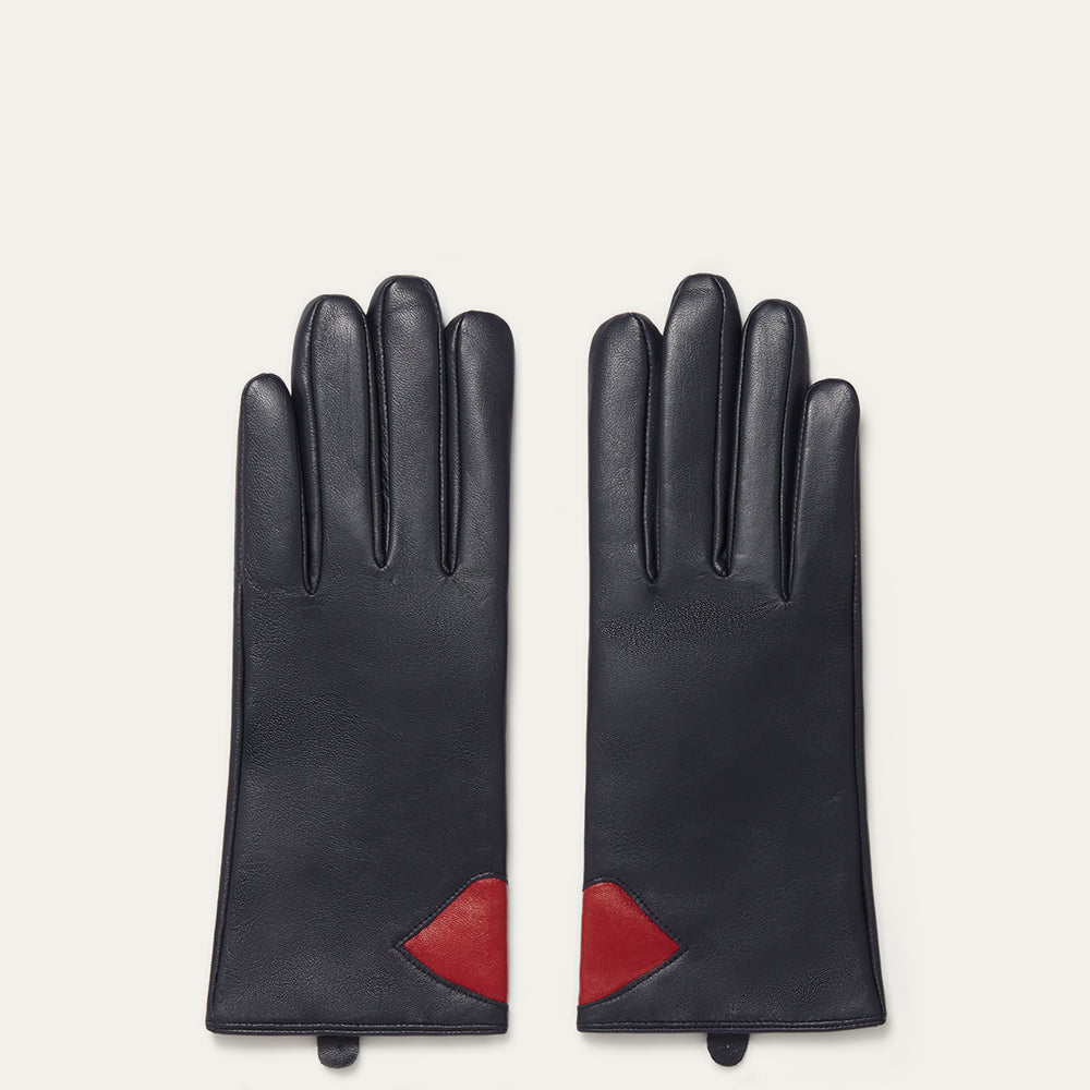Pair of navy leather gloves with red accents on a light gray background