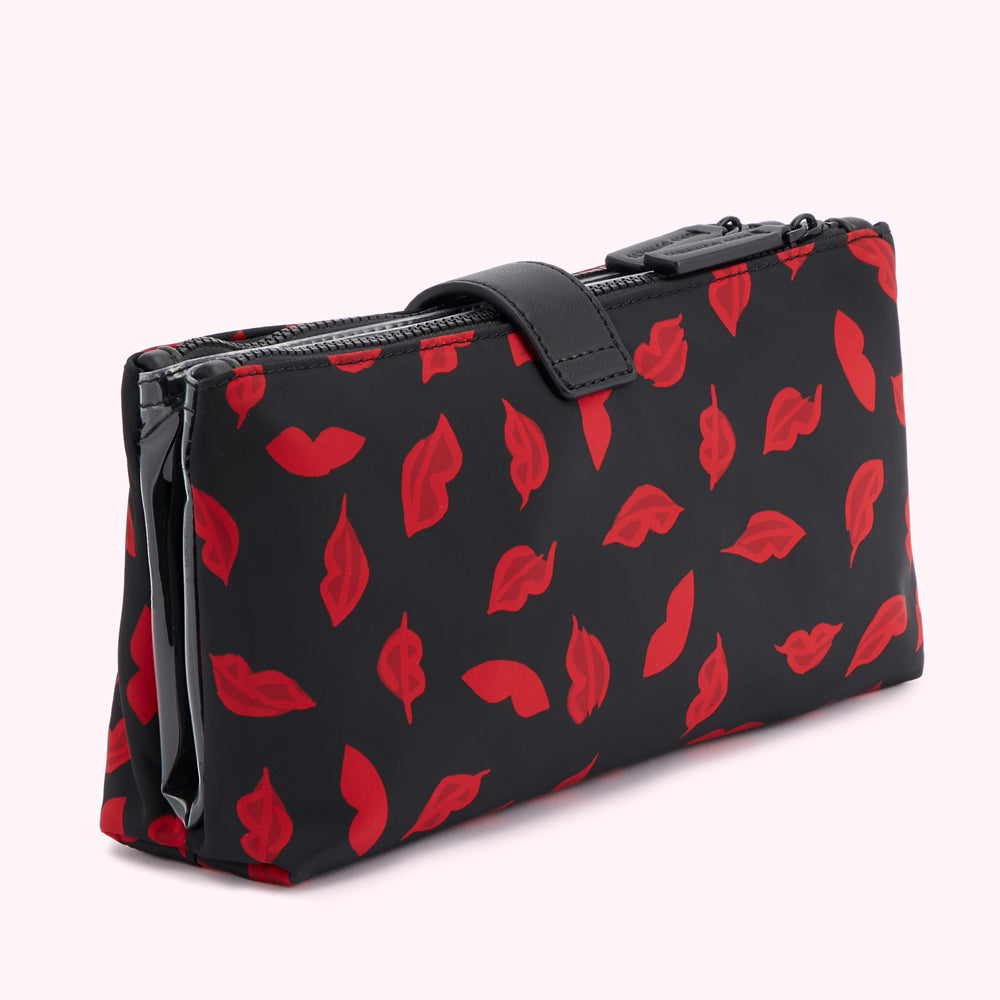 Black double zippered makeup bag with a red lips print.