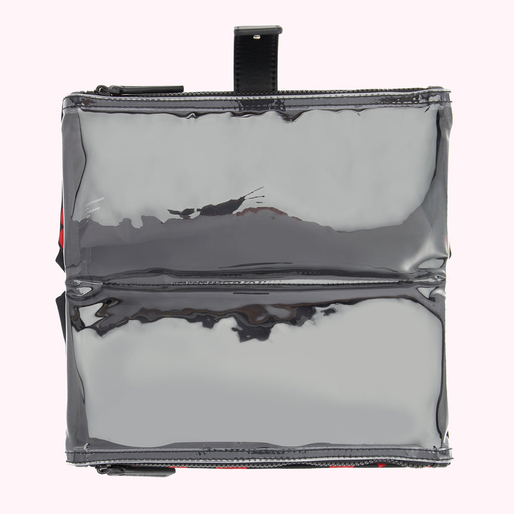 Overhead view of a clear, black, zippered pouch with a black leather handle.