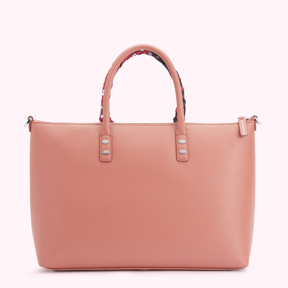Dusty rose tote bag with patterned handles and silver accents.