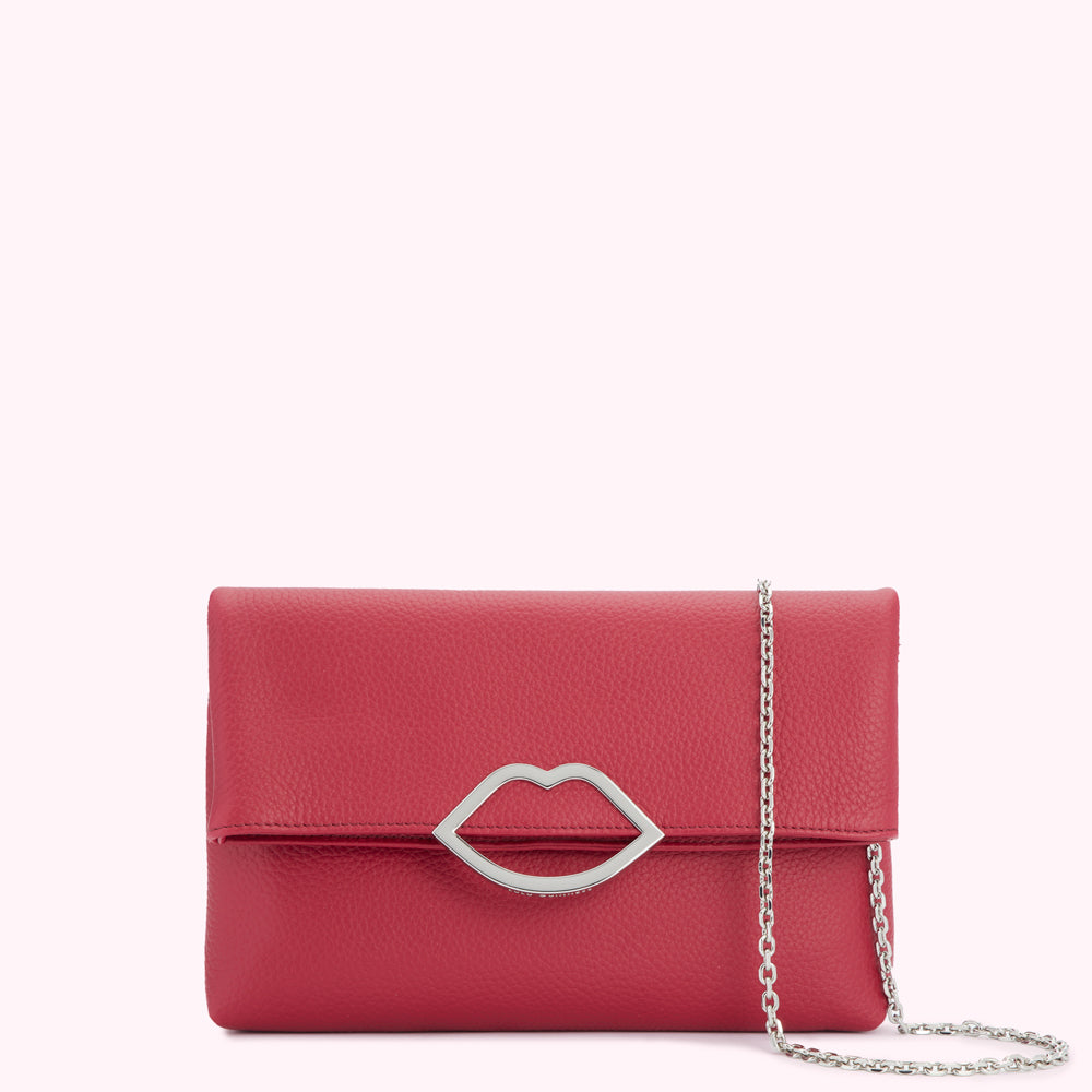 Red leather clutch with silver lip-shaped clasp and chain strap.
