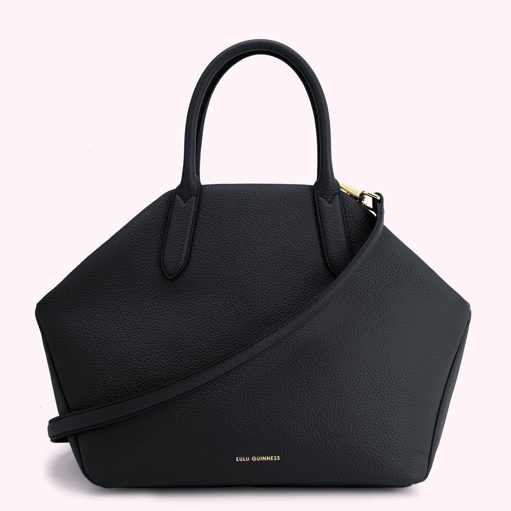 Black Lulu Guinness handbag with top handles and shoulder strap.
