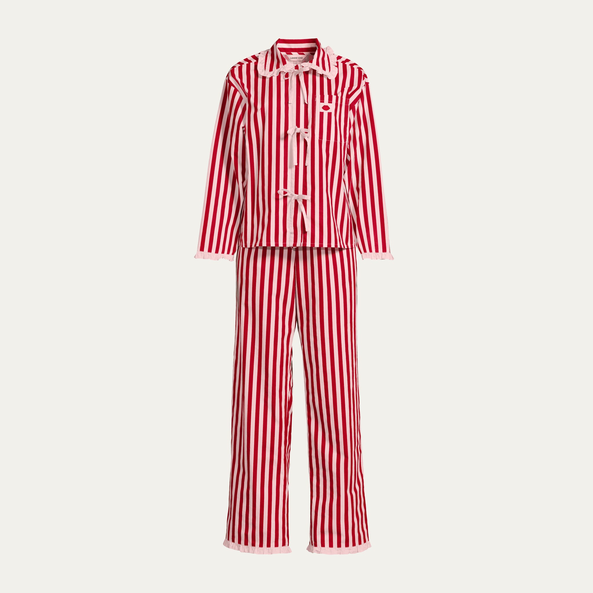 Red and pink striped pyjama set on a light gray background