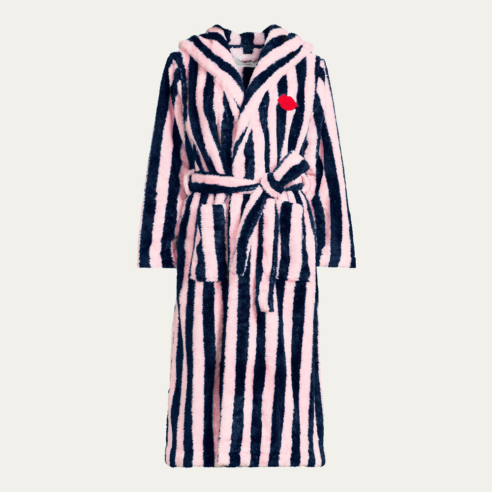 Navy and pale pink striped robe with a red embroidered lip on a beige background