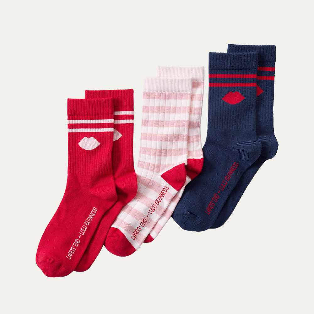 Three pairs of socks in red, pink, and navy on a light gray background