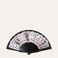 Black folding fan with playing card designs on a white background