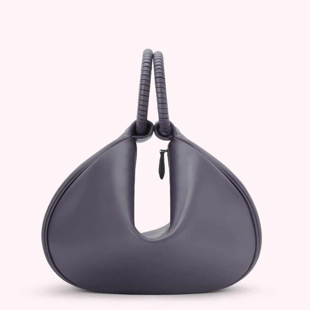 Purple leather handbag with twisted top handles.

