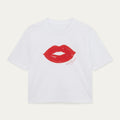 White t-shirt with red lips graphic and text on a light gray background