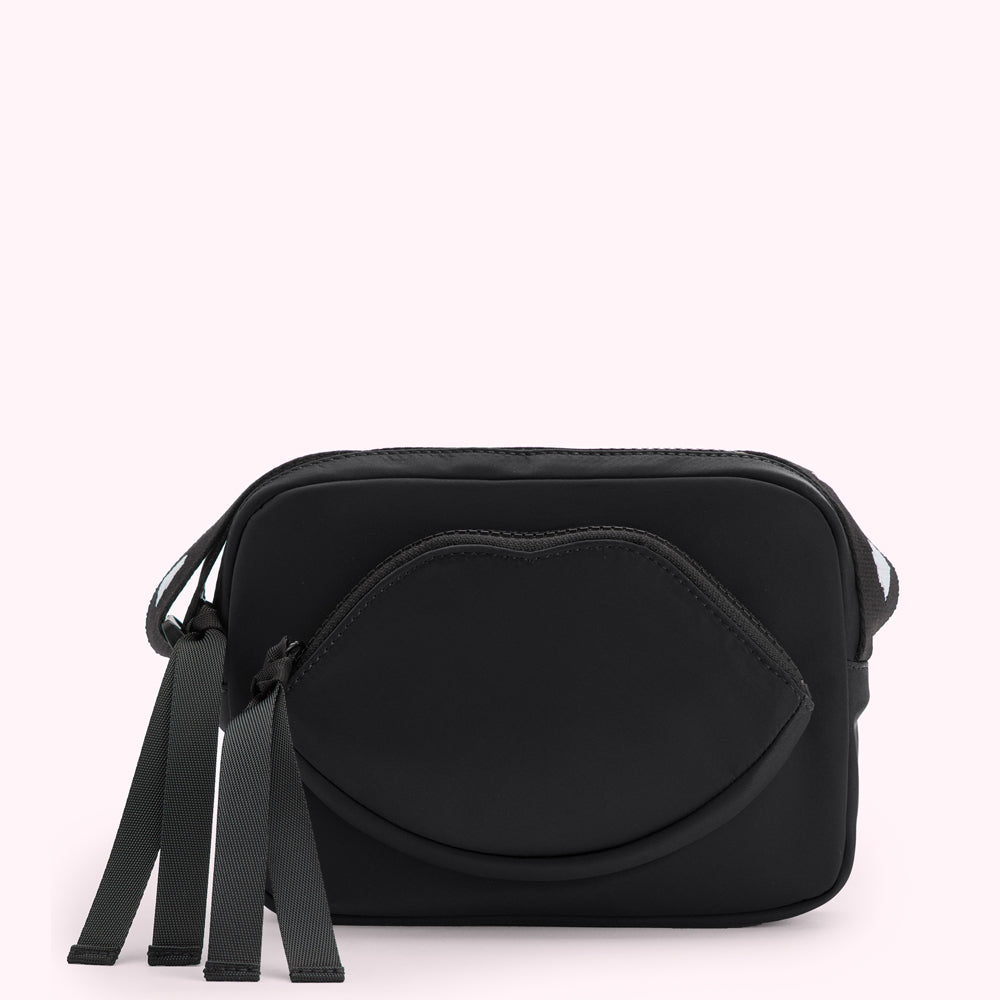 Black crossbody bag with a lip-shaped pocket and grey straps.