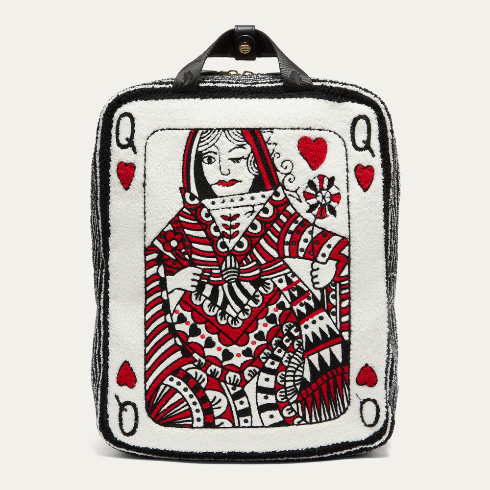 A square white boucle backpack designed with a red and black illustrated queen playing card on front with black stripe side panels and zipped top opening with black top handle