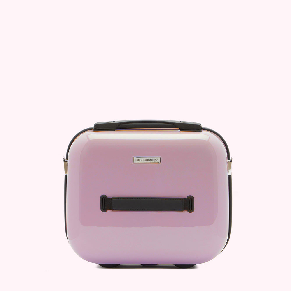 Lilac Lulu Guinness vanity case with black handle and rose gold accents.
