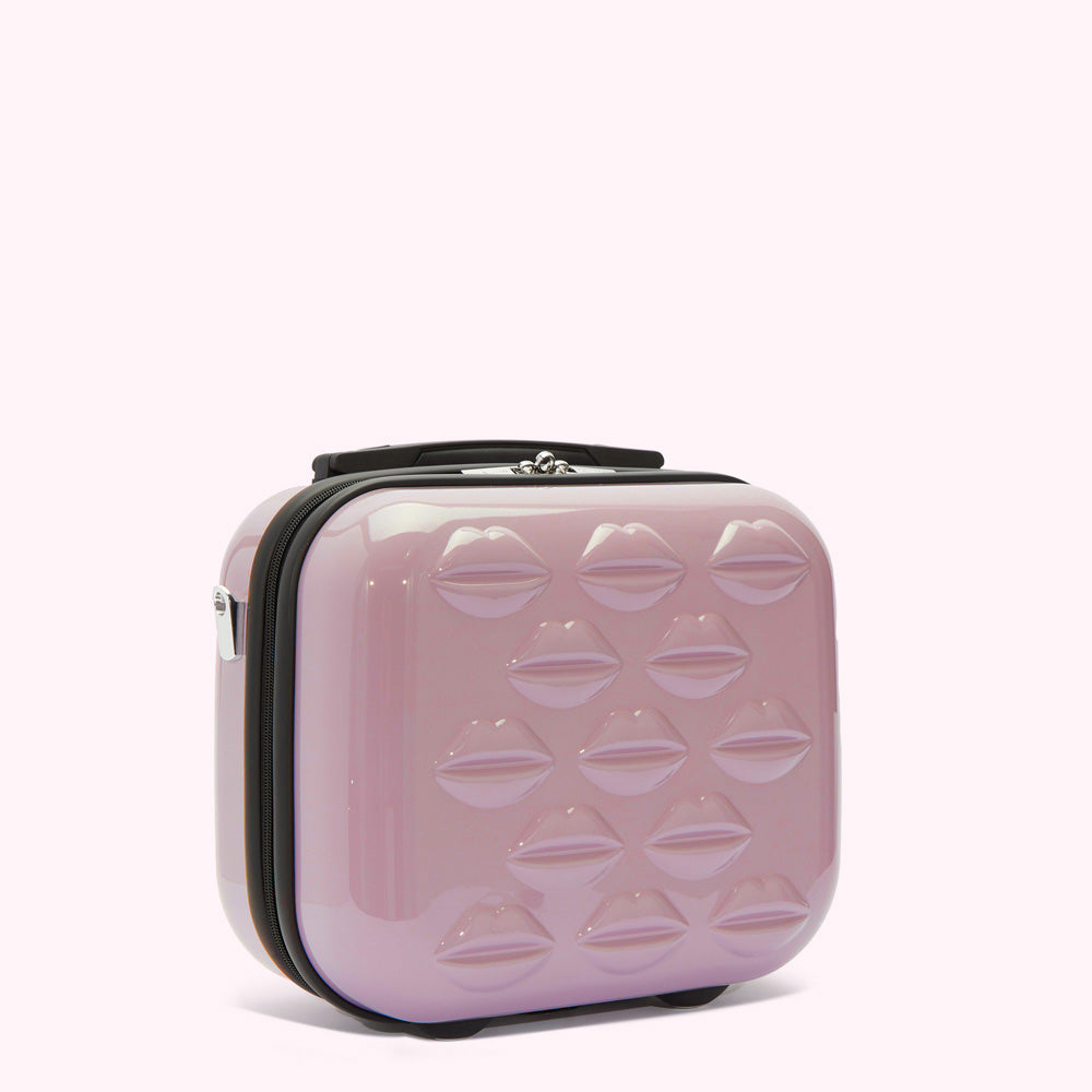 Pink carry-on suitcase with lip print.