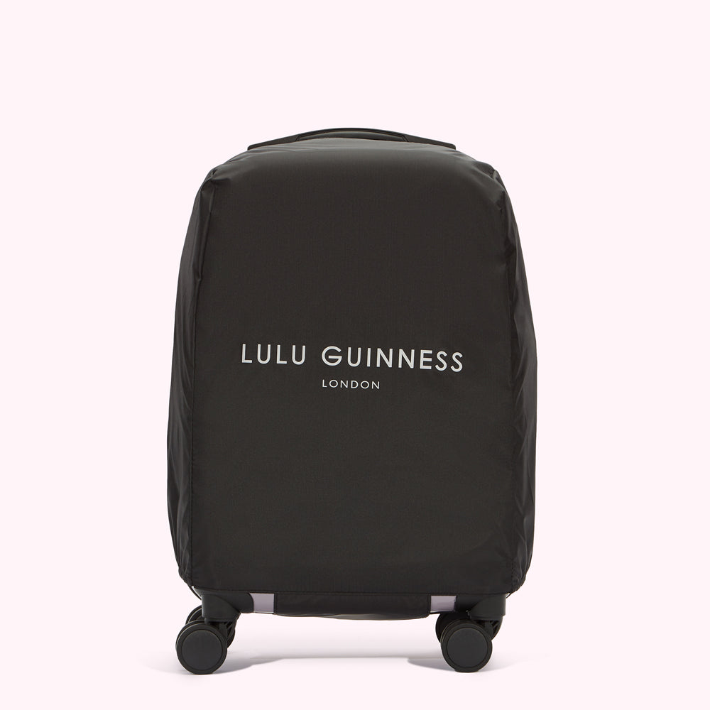 Black Lulu Guinness London luggage cover on wheels.
