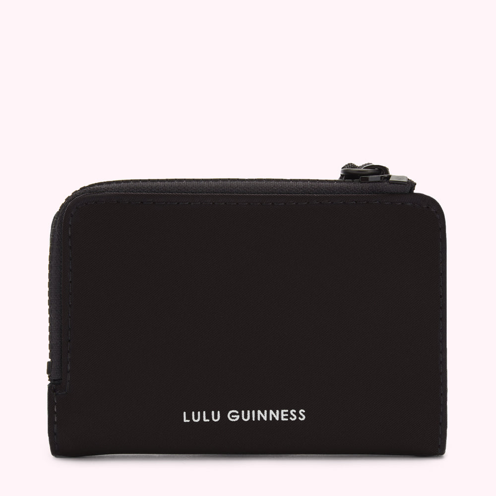 Black Lulu Guinness zip-around wallet against a white background.
