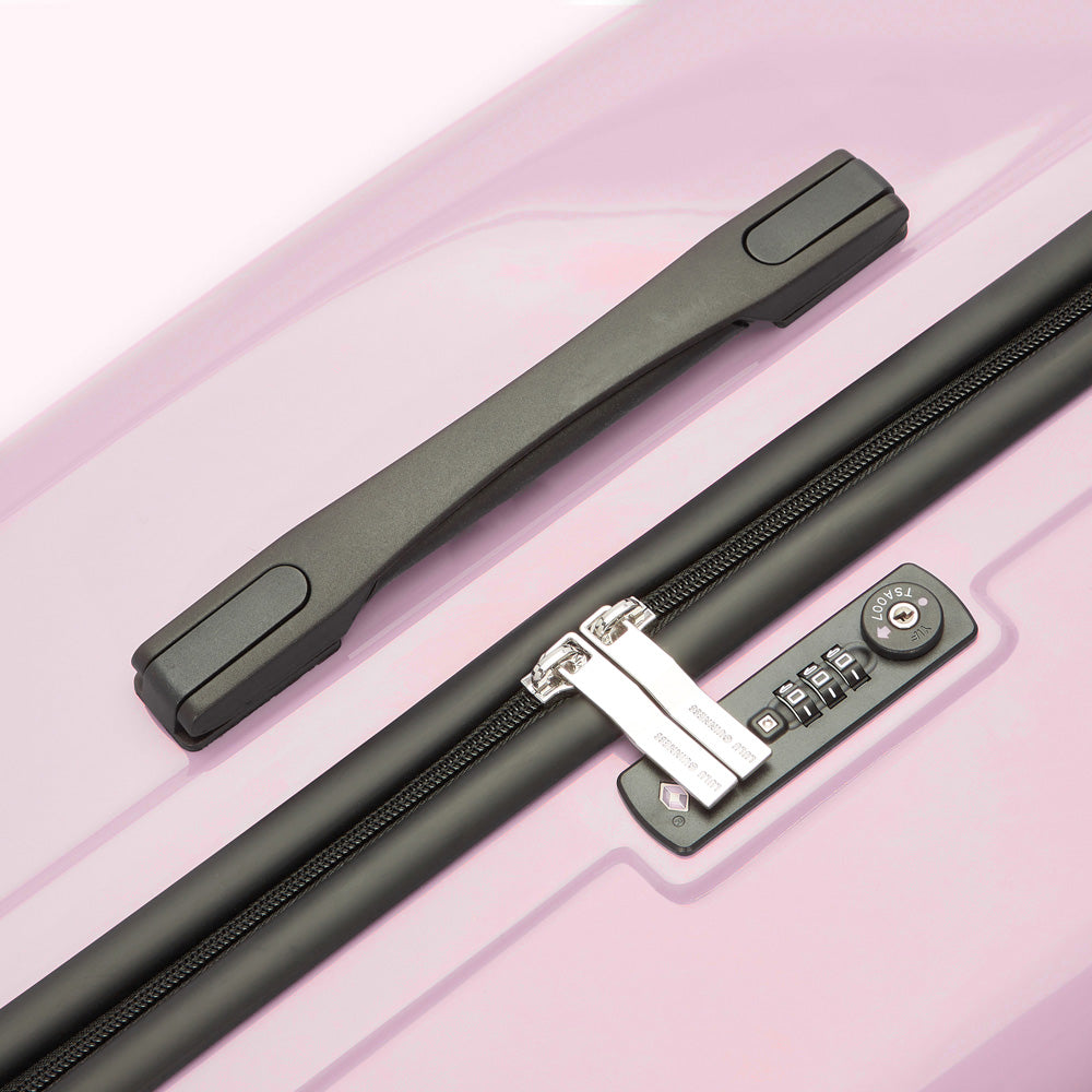 Close-up of a lavender suitcase showing the top handle and TSA-approved combination lock.
