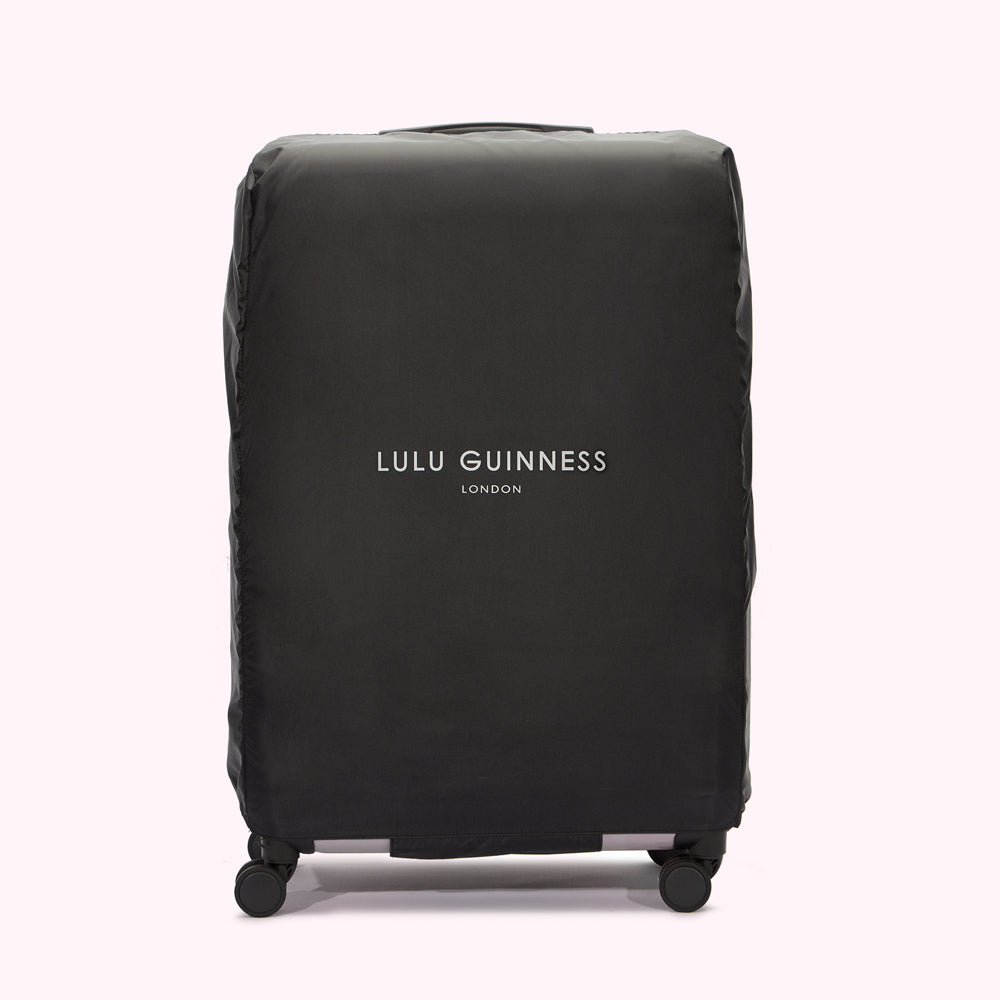 Black Lulu Guinness London luggage cover on a white background.
