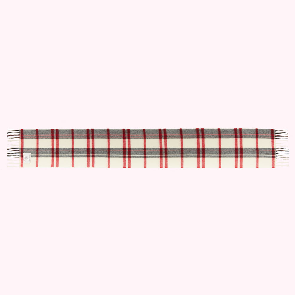 Off-white rectangular scarf with red and grey plaid or tartan pattern and fringed edges.
