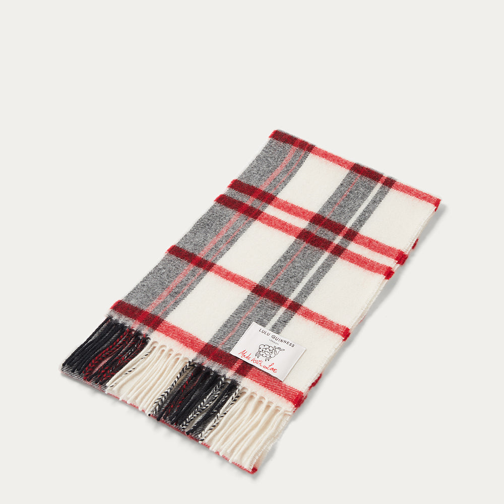 Plaid scarf with red, gray, and black pattern on a white background
