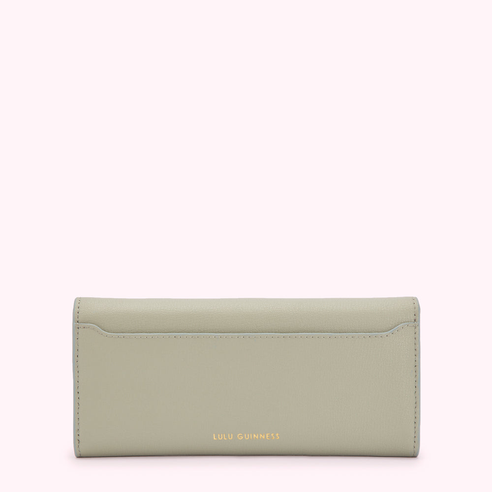 Sage green leather Lulu Guinness wallet, back view.
