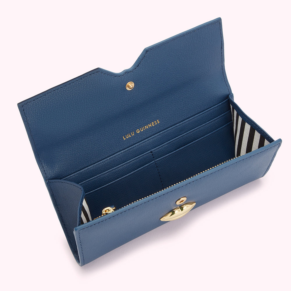 Open blue Lulu Guinness wallet with gold clasp.