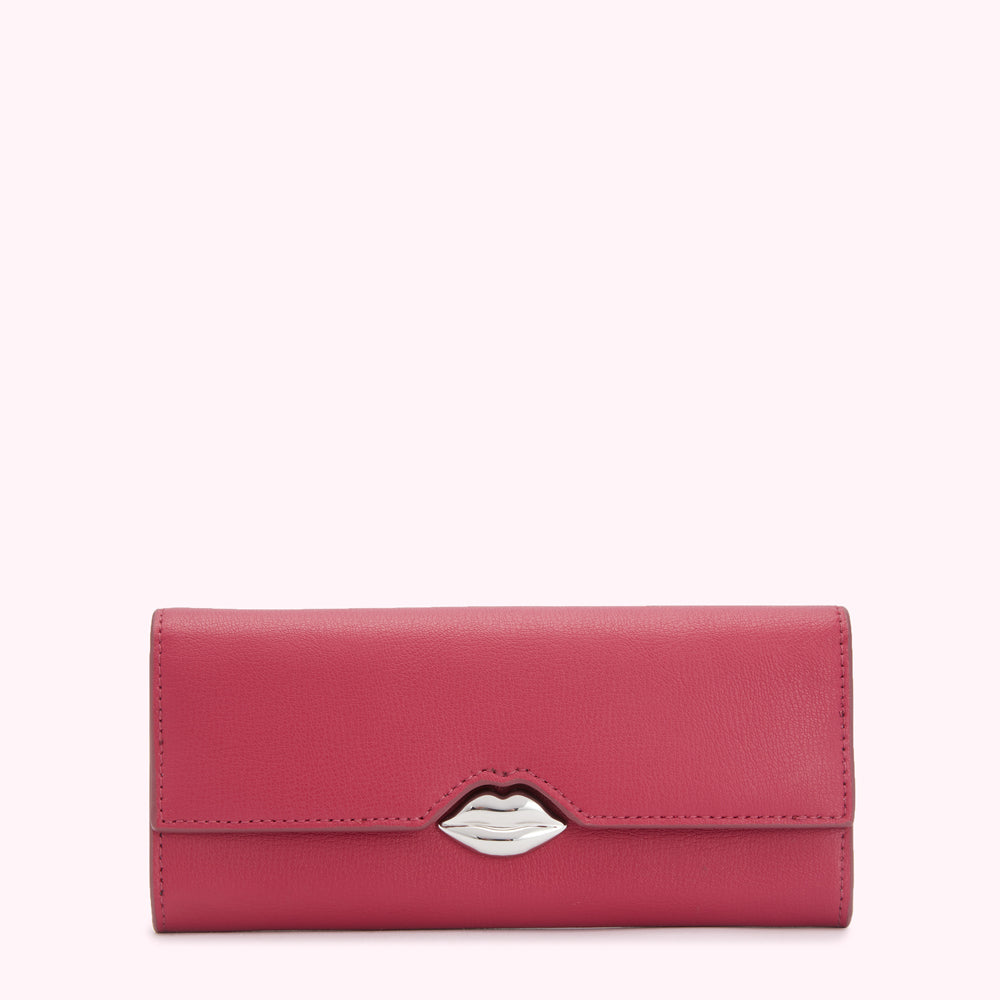 Pink leather wallet with a silver lip-shaped clasp against a white background.
