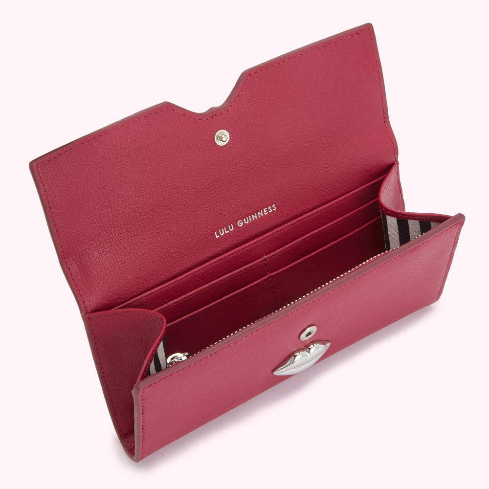 Open crimson Lulu Guinness wallet with silver lip detail.