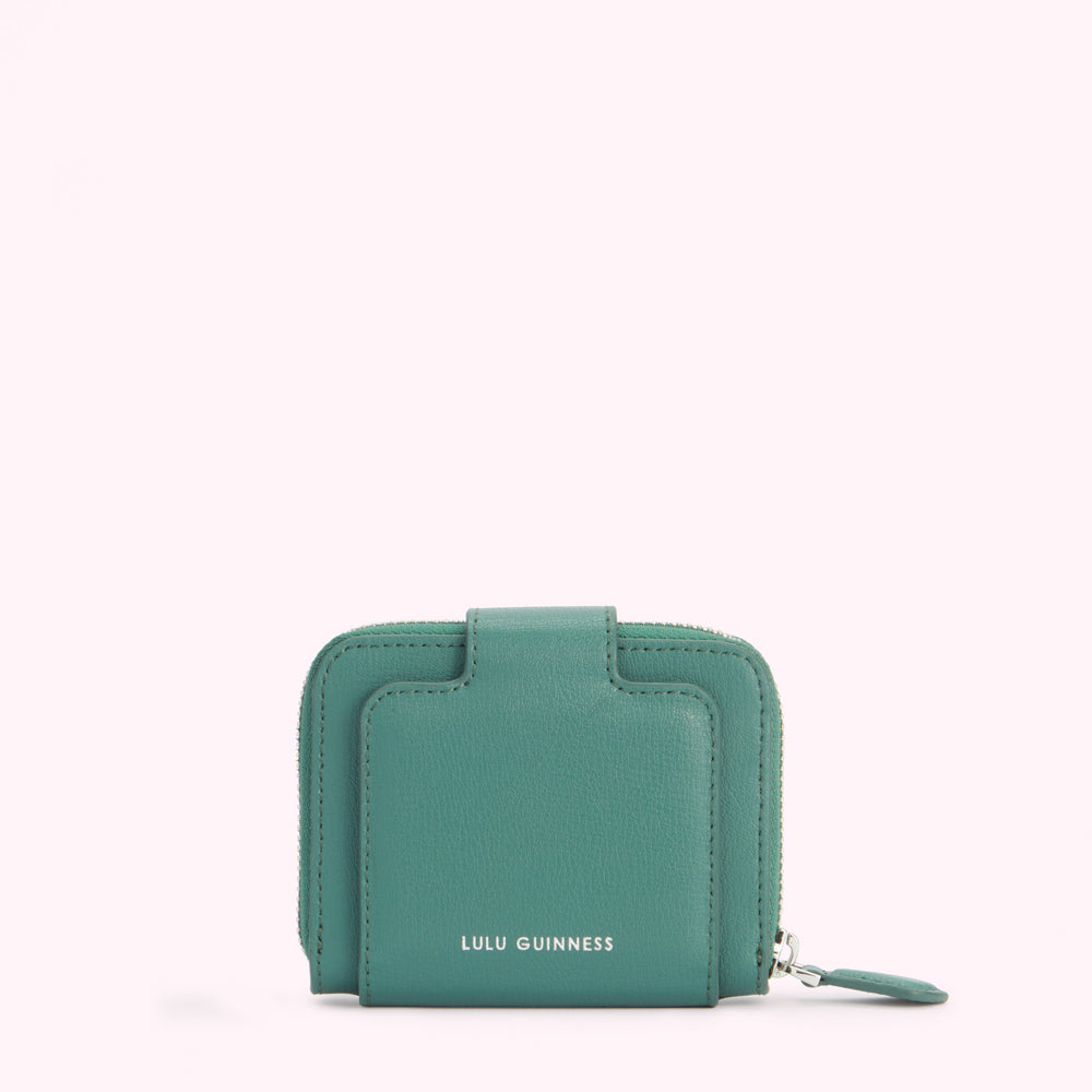 Teal Lulu Guinness zip-around wallet against a white background.
