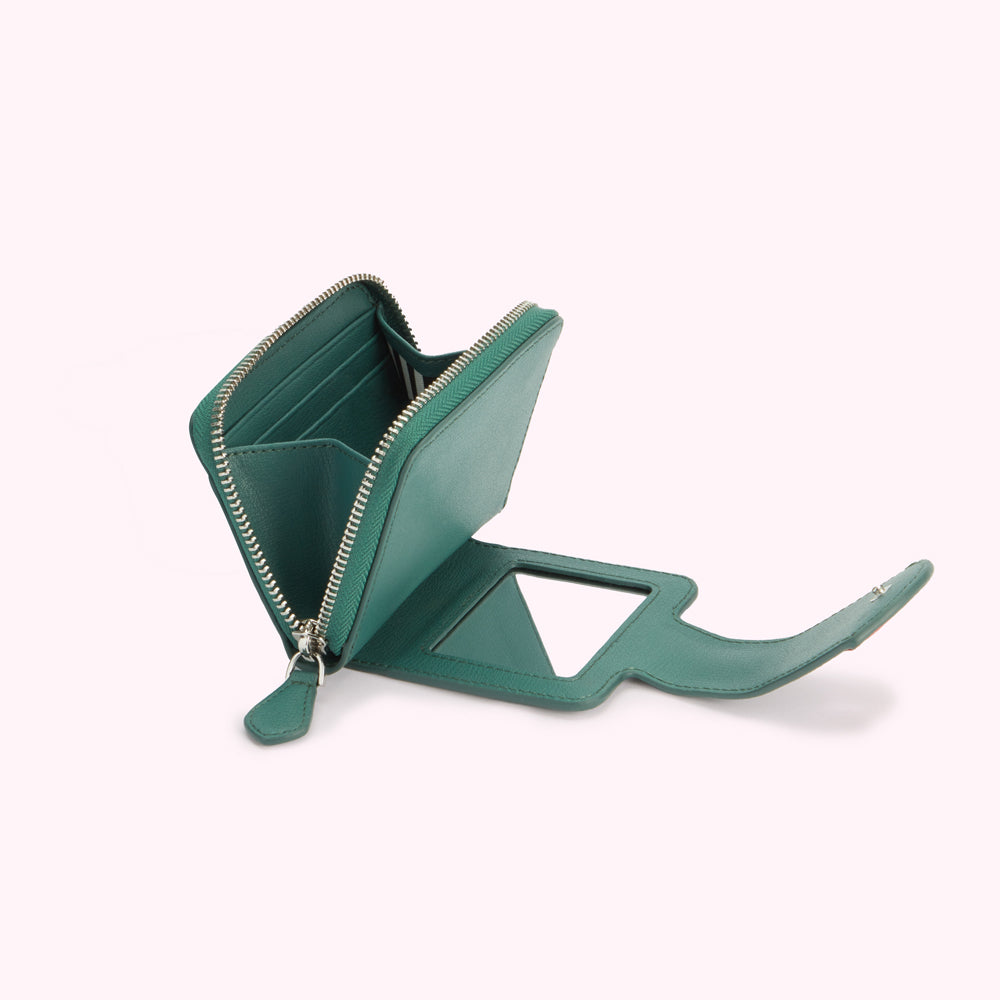 Teal leather wallet with a built-in mirror, open to display its interior.
