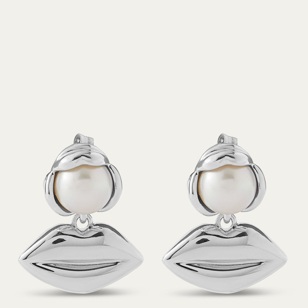 Silver lip pendant drop earrings with pearls on a white background