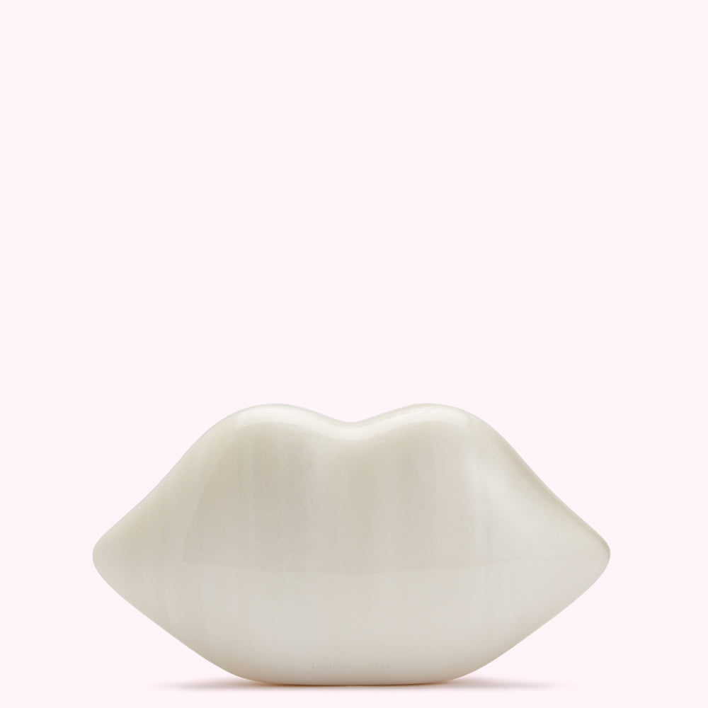 Off-white, sculpted lips on a white background.
