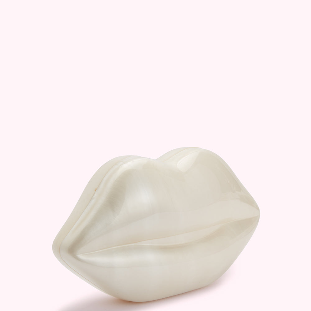 Off-white lip-shaped clutch bag against a white background.
