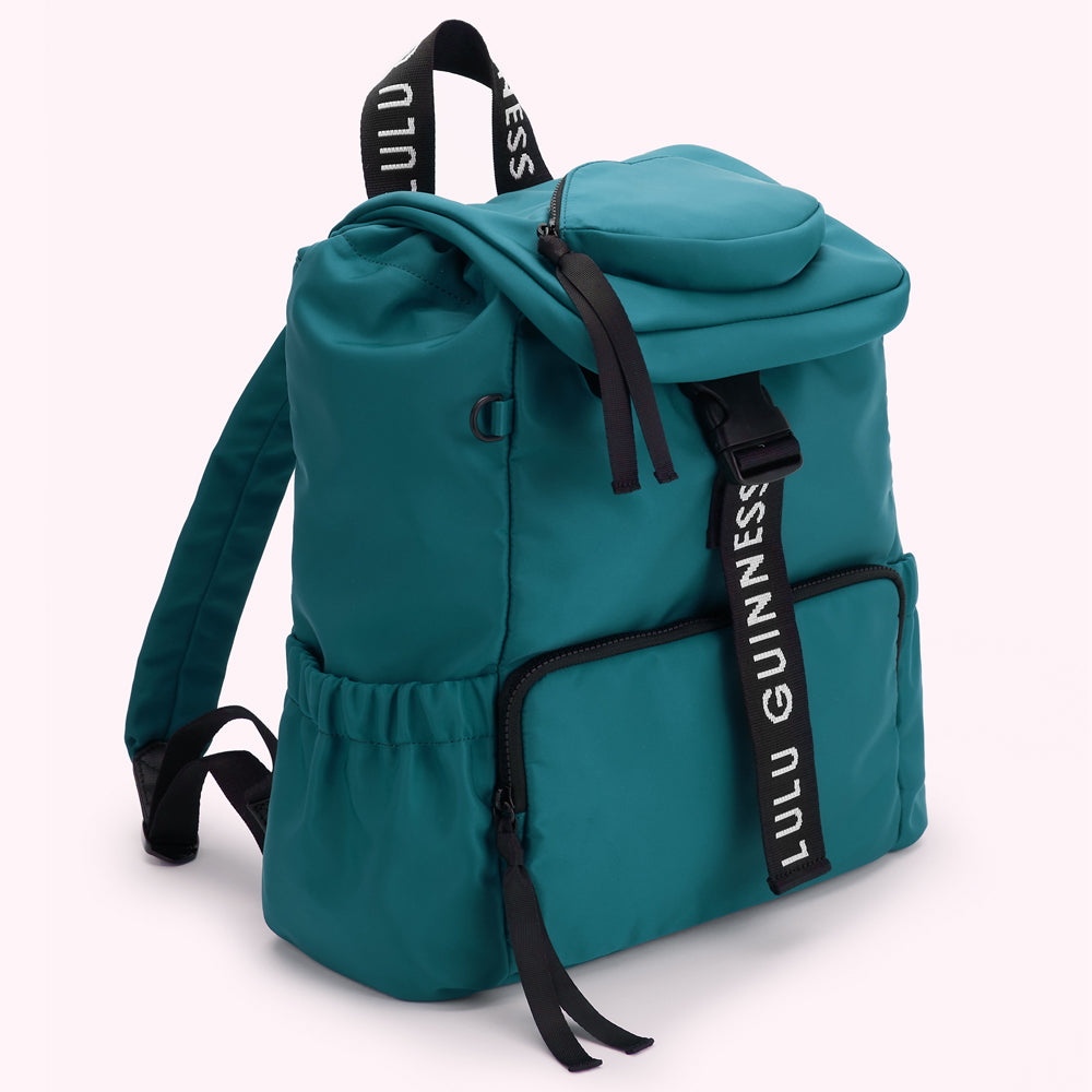 Teal Lulu Guinness backpack with black straps and zipper.