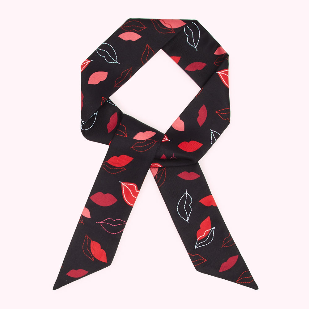 Black hair scarf with red lips print.