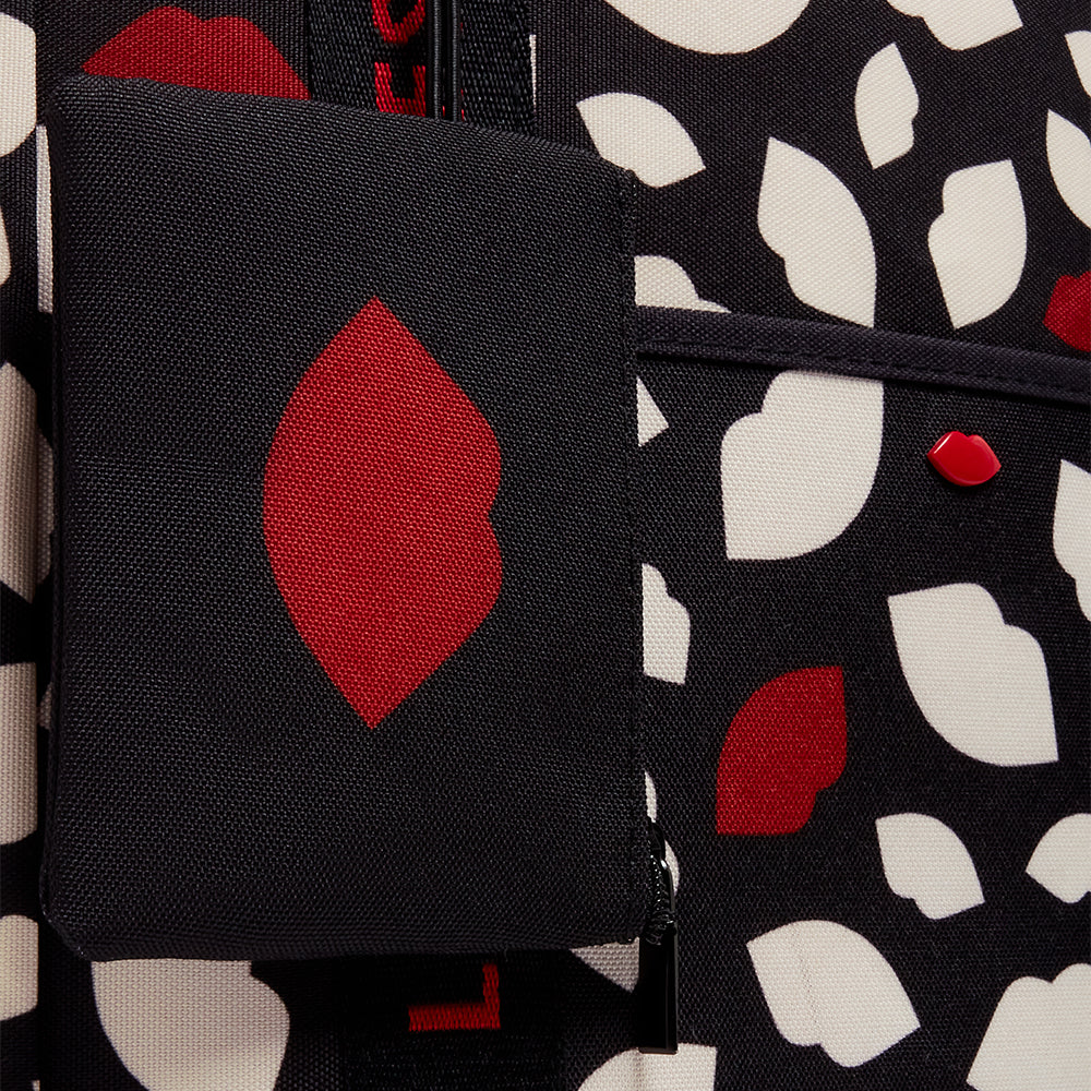 Close up image of a red, white and black lip flurry print tote with a black detachable pouch lack pouch 