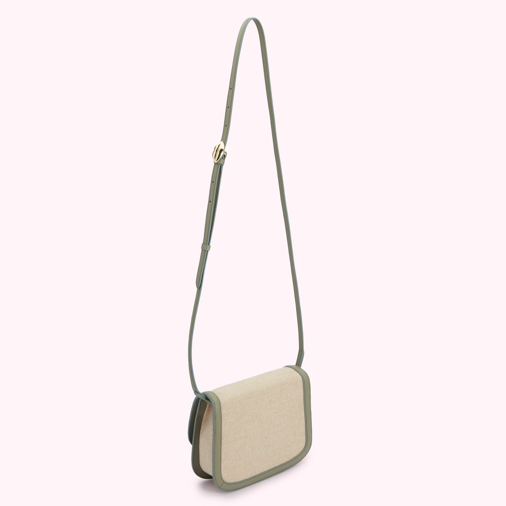 Sage green crossbody bag with a beige linen body and a gold clasp.
