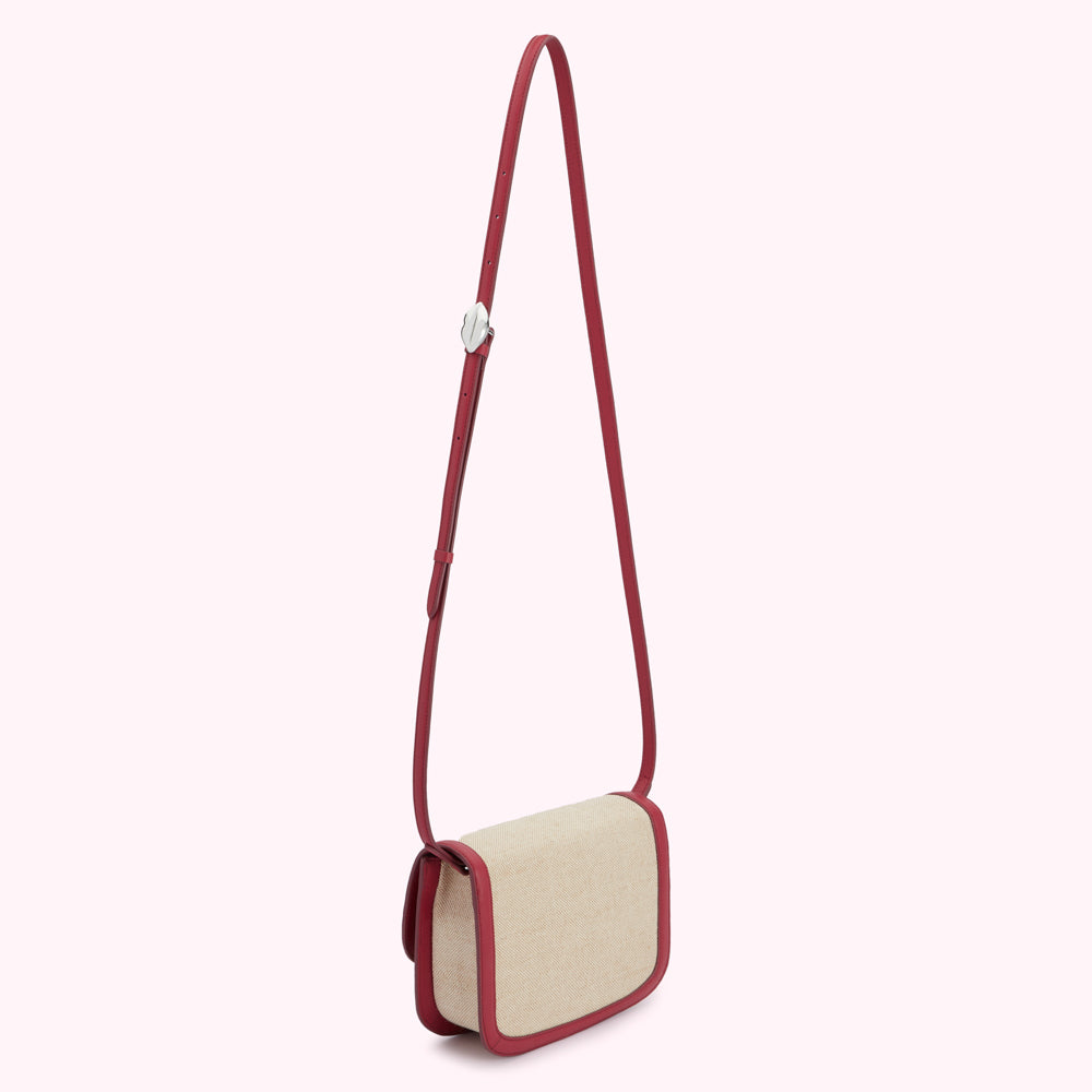 Red and beige crossbody bag with a long strap.
