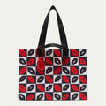 A tote bag with a black and white checkerboard pattern featuring red and black lips print, black shoulder straps, and a red hanging tag, shown against a light gray background.