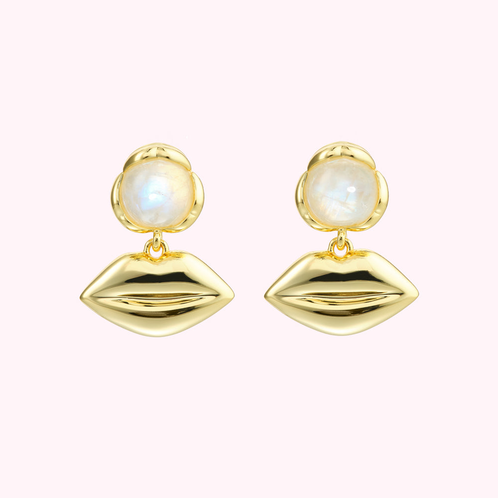 Gold lip earrings with moonstone accents.
