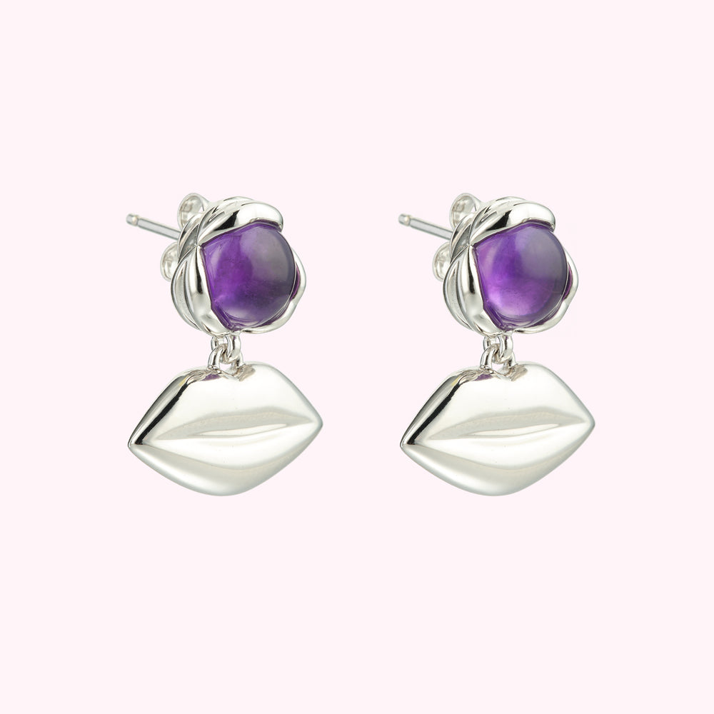 Silver lip earrings with amethyst stones.
