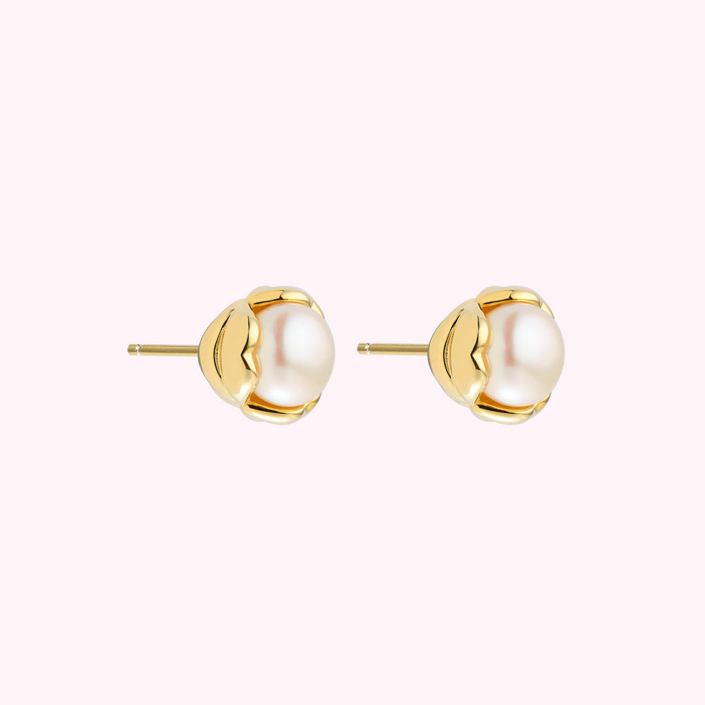 Pair of gold pearl stud earrings.
