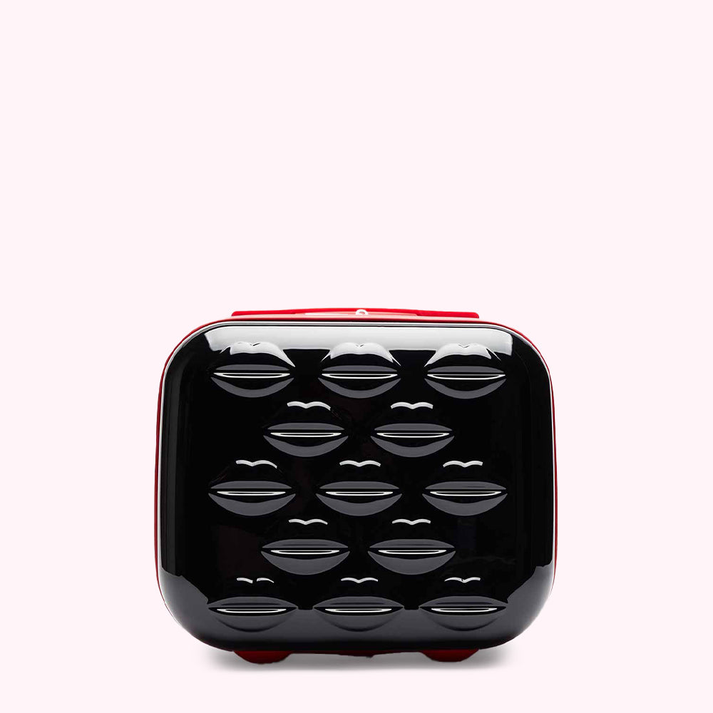 Black hard-shell makeup case with red trim, featuring a repeating pattern of embossed lips.