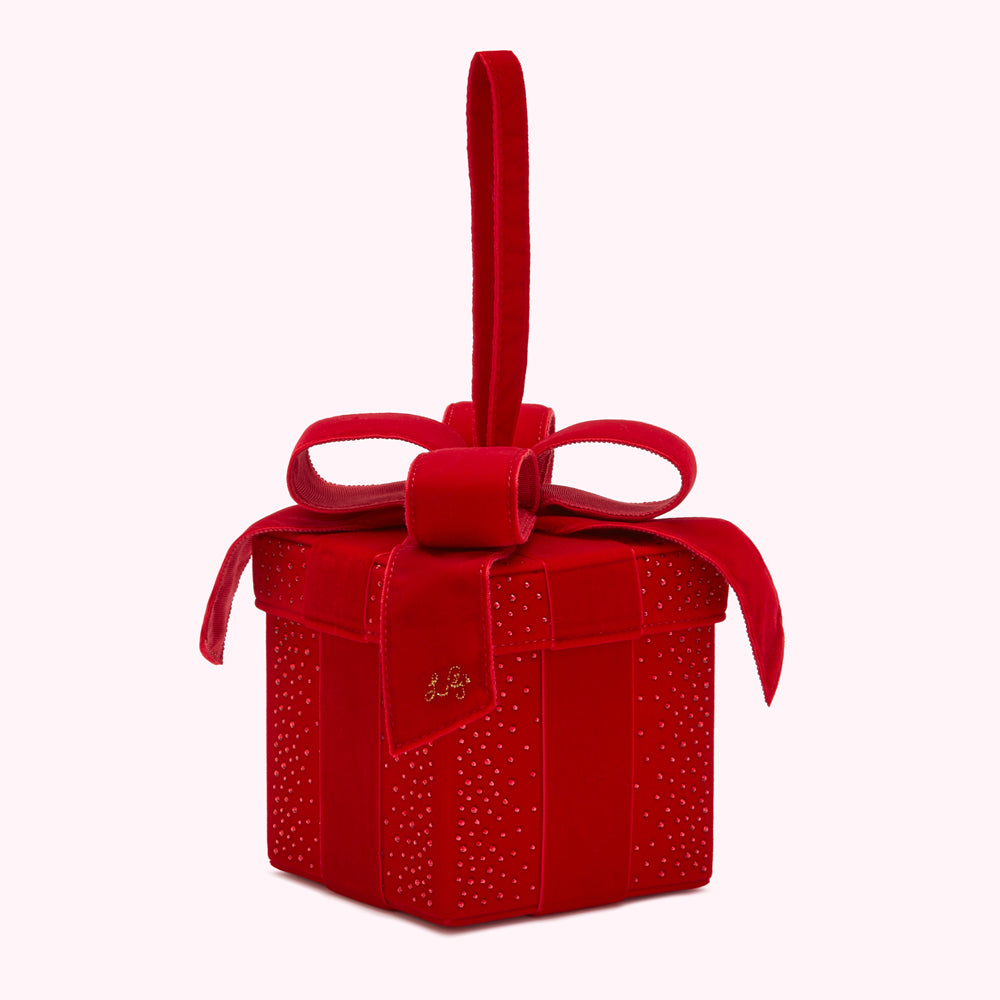 Red velvet gift box-shaped handbag with a large bow and a handle.