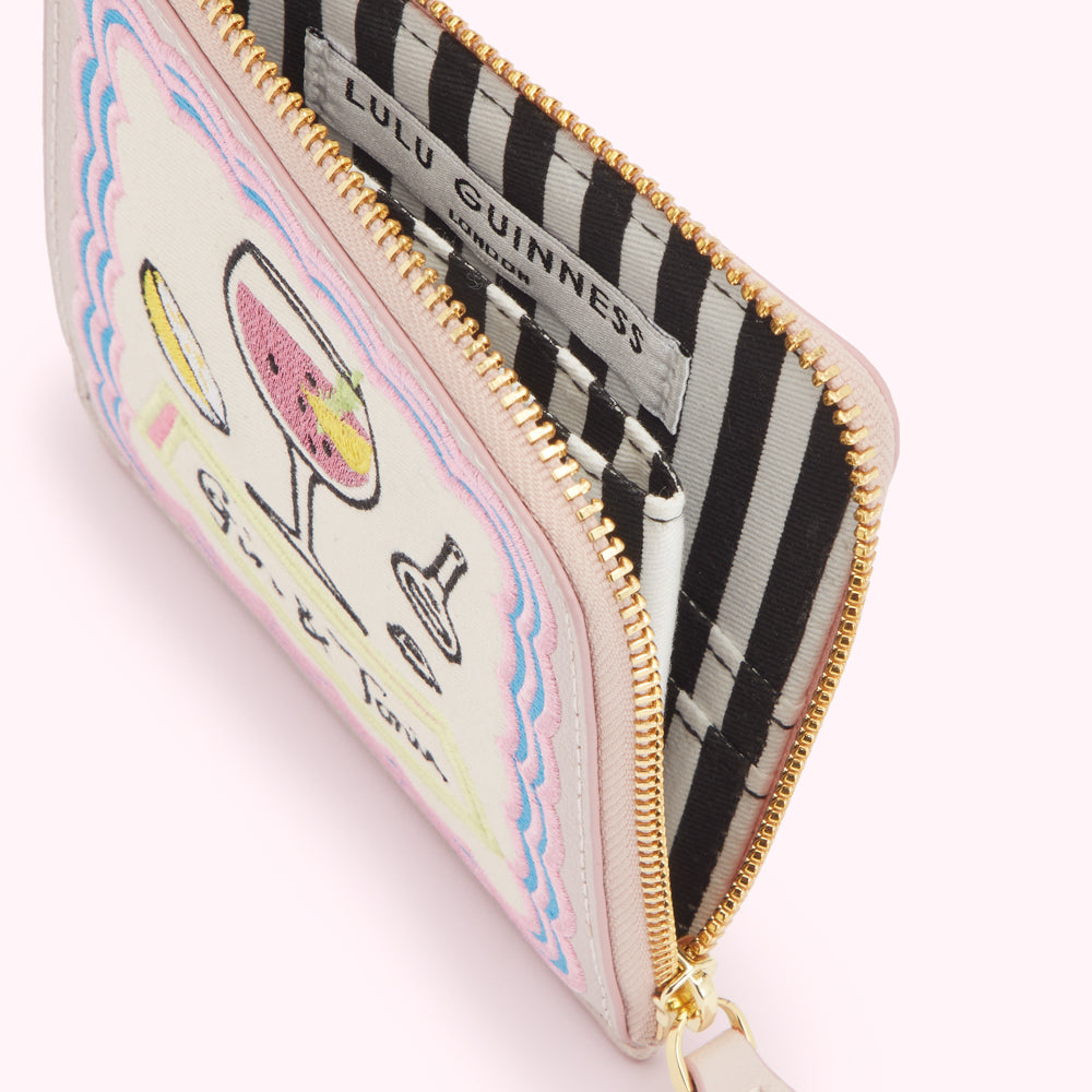 Pink Lulu Guinness zip-around purse with cocktail embroidery.