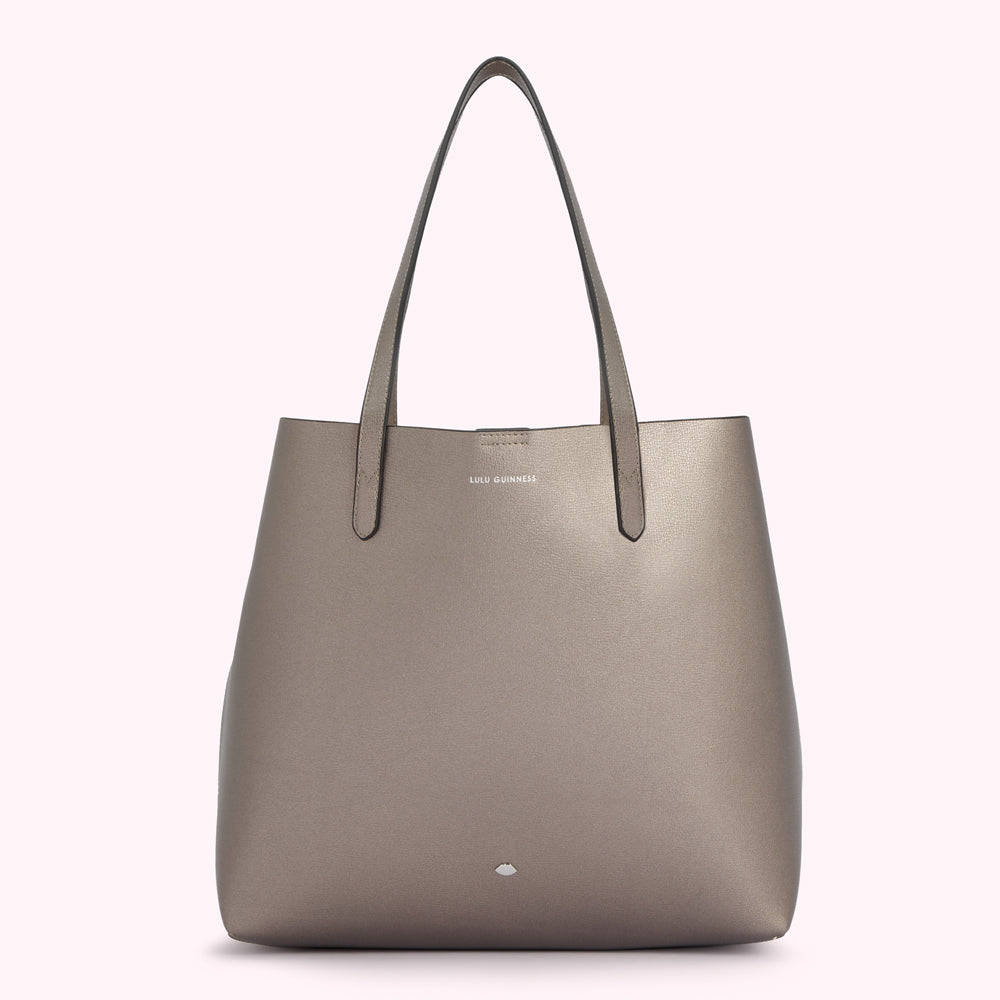 A metallic taupe Lulu Guinness tote bag on a white background.
