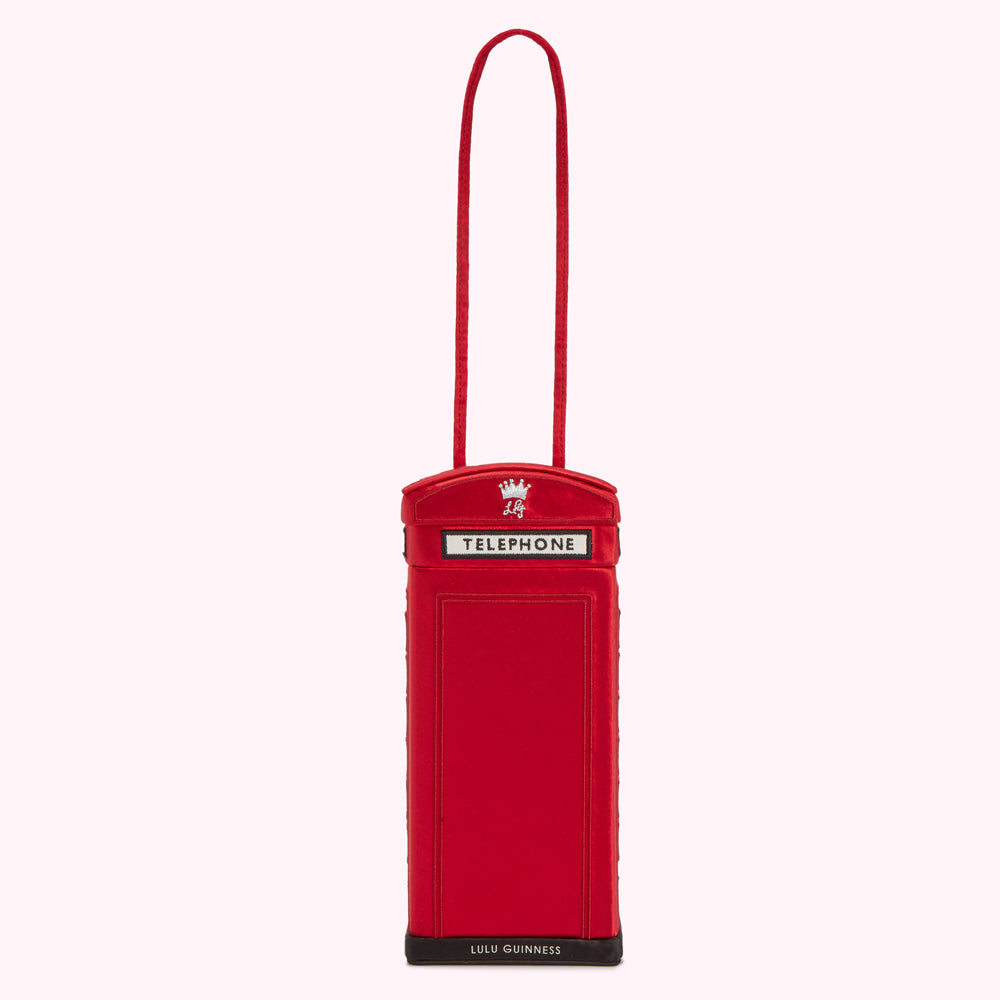 Red Lulu Guinness phone bag shaped like a British telephone booth.