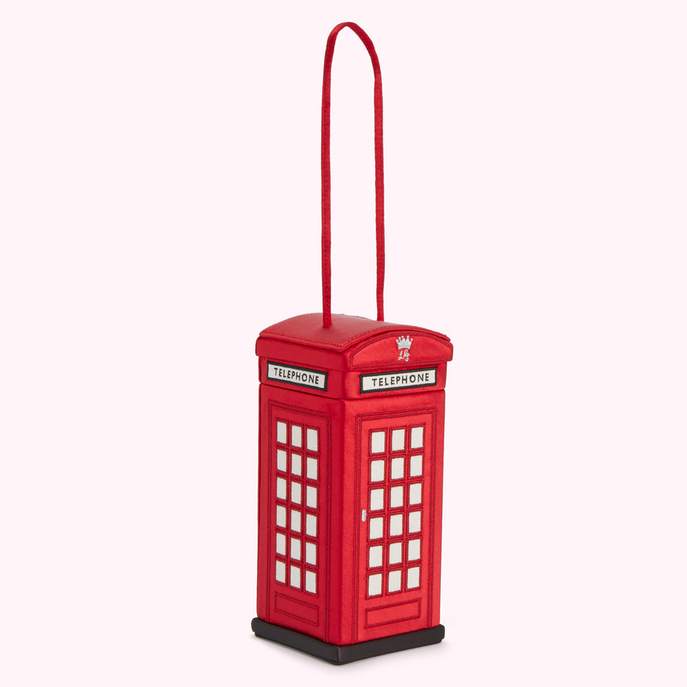 Red telephone booth-shaped handbag with a satin handle.

