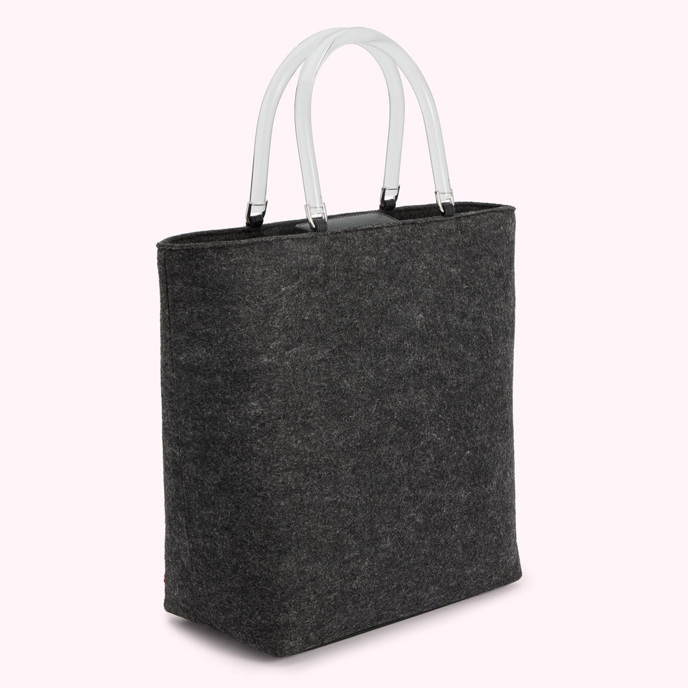 Dark grey felt tote bag with clear acrylic handles.
