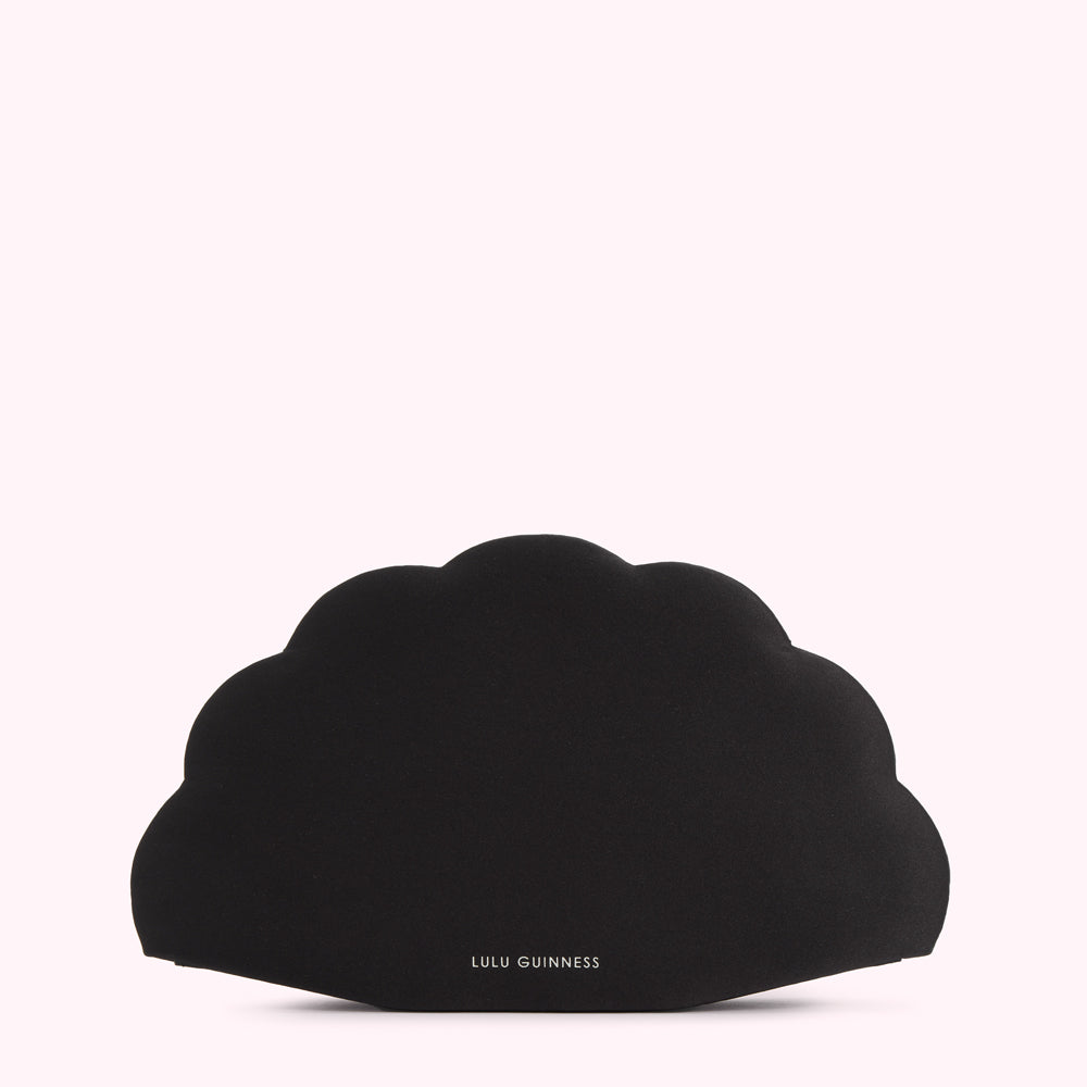 Black Lulu Guinness fan-shaped clutch against a white background.
