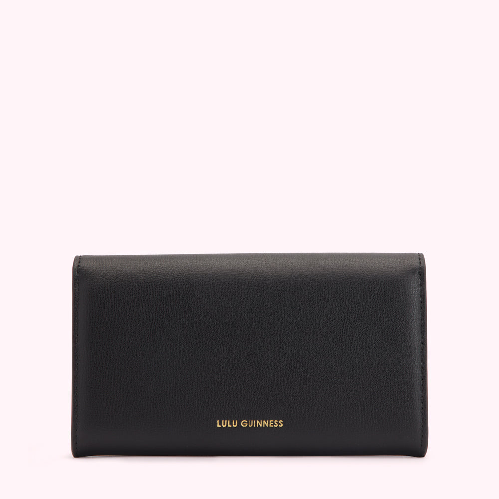 Black Lulu Guinness wallet on white background.
